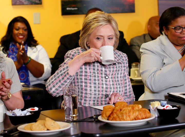 Democratic presidential candidate Hillary Clinton sips coffee during a California campaign stop. None of the candidates have said much about food policy of late.