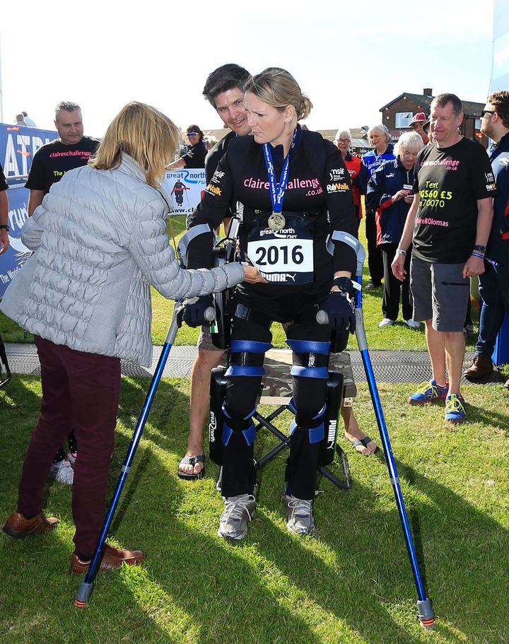 Claire Lomas, who was injured in a riding accident, leaving her paralyzed, crosses the finish line in the Great North Run half-marathon in South Shields, north east England, on Sunday.