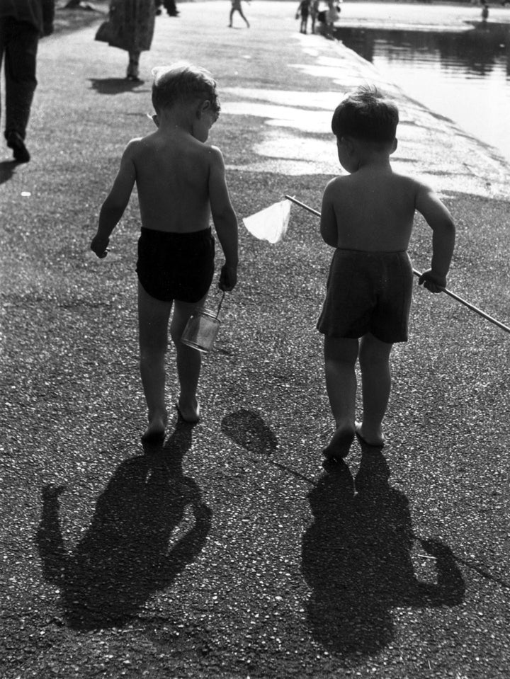 A pair of young anglers in London's Hyde Park, during hot weather in September 1949