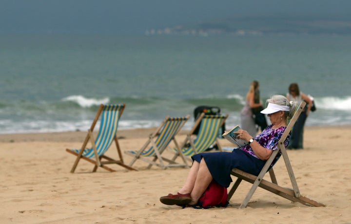 People enjoying the sun in Bournemouth on Tuesday, shortly before a thunder and lightning storm