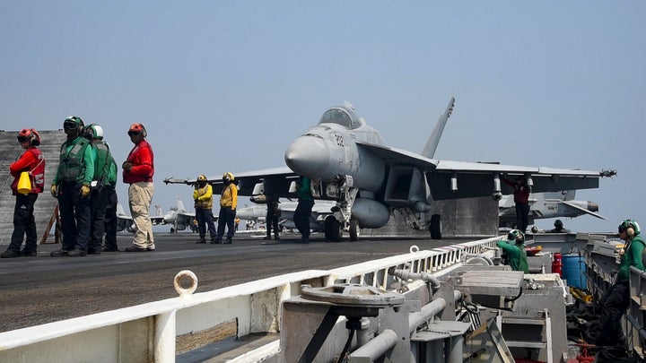 The new mom was assigned to the aircraft carrier's air wing. The warship is in the Persian Gulf to support Operation Inherent Resolve.