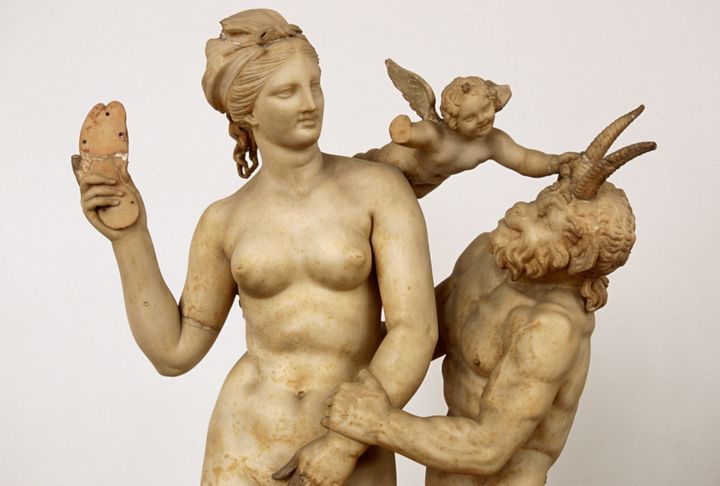 A marble statue featuring Aphrodite, Pan and Eros, on display at the National Archaeological Museum of Athens 
