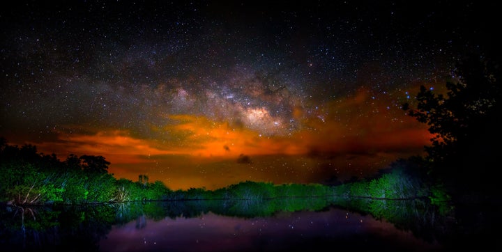 Brush fires in Everglades National Park make for a dramatic Milky Way in this panorama.