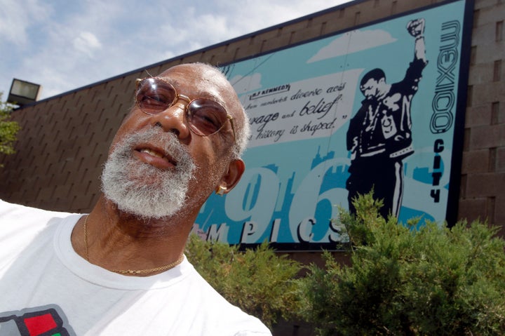 John Carlos, participant of the 1968 Olympics, stands in front of a mural made by students on the campus, at Palm Springs High School, where he is a teacher and counsellor in Palm Springs, California.