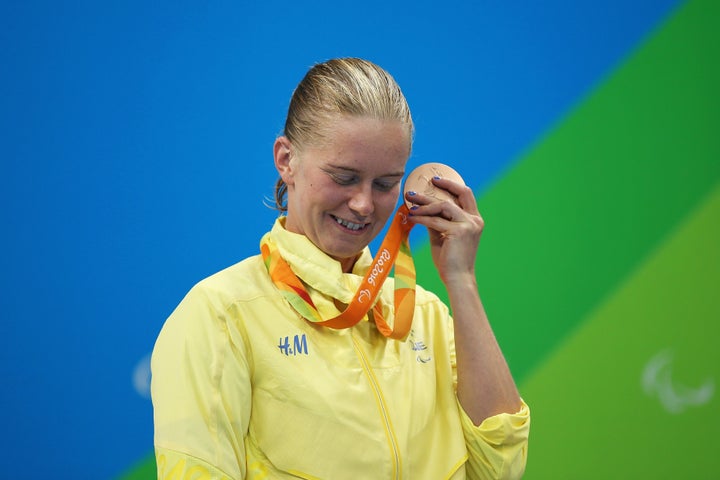 Maja Reichard of Sweden rattles her bronze medal after the Women's 100m Backstroke.