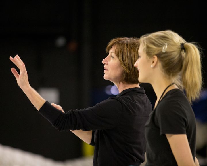 Choreographer Cindy Stuart working with a performer during rehearsal