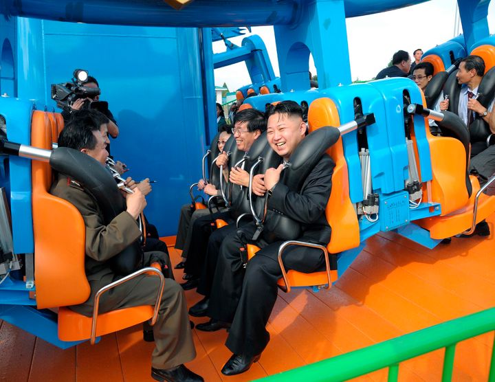 Kim Jong-un laughing at the fair.