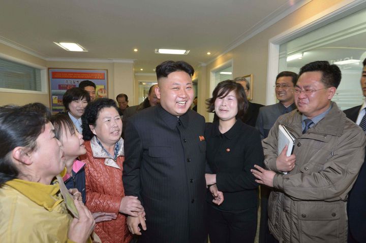 <strong>Kim Jong-un laughing with some women.</strong>