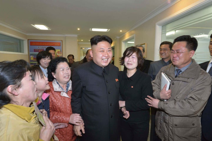 Kim Jong-un laughing with some women.