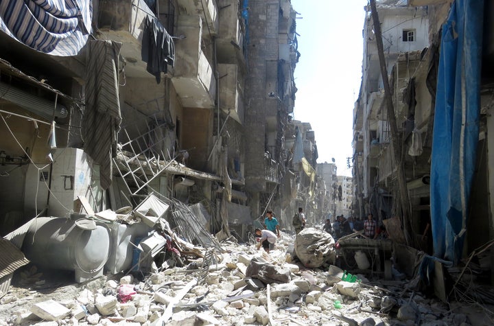 Debris of buildings is seen after Russian forces reportedly hit a residential area of eastern Aleppo with clus