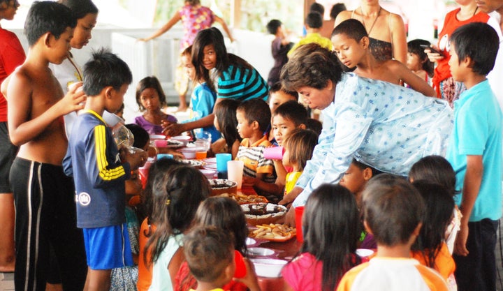 Kids, enjoying the treats at a birthday party