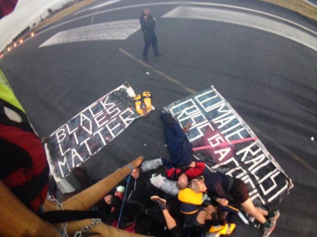 A picture taken by the protestors shows them lying down, chained together, occupying the tarmac