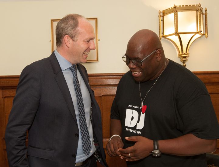 Justin Tomlinson and DJ Carl Cox share a joke at the House the House DJ competition grande