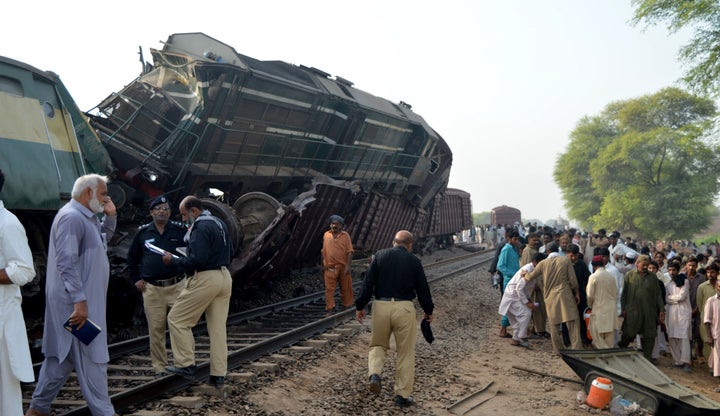 People crowd around the accident site in Multan, Pakistan.