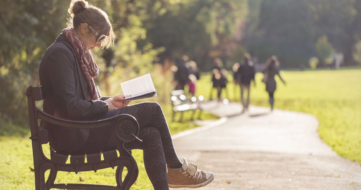 This fall. Woman sitting on Bench. Sitting reading book. Sit reading book. Sitting on book.