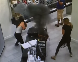 The scary moment when an e-cigarette exploded inside a woman's handbag.