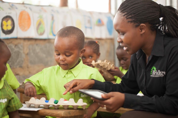 Bridge uses low-cost learning tools to assist learning, like these counters made from egg cartons and bottle tops