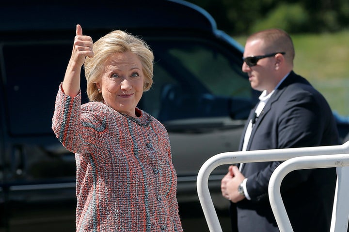 Hillary Clinton gives a thumbs up as she boards her campaign plane in White Plains, New York, United States September 15, 2016, to resume her campaign schedule following a bout with pneumonia.