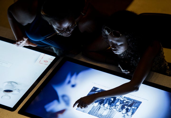 Visitors try out one of the interactive displays.