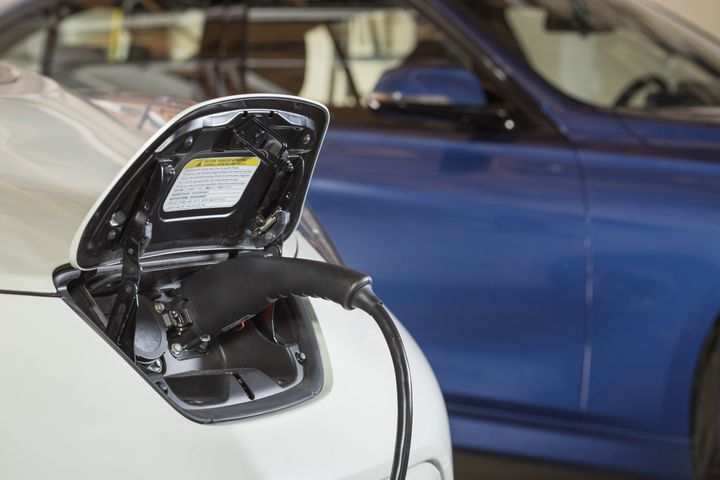 Close up of electric car charger Don Mason via Getty Images