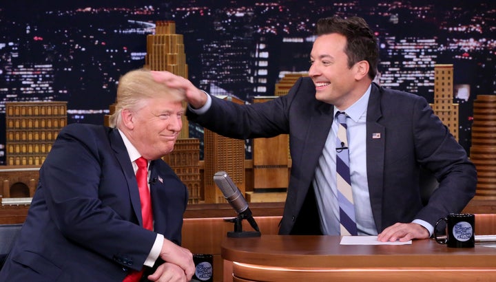 Republican Presidential Nominee Donald Trump gets a head rub during an interview with Jimmy Fallon on Sept. 15, 2016.