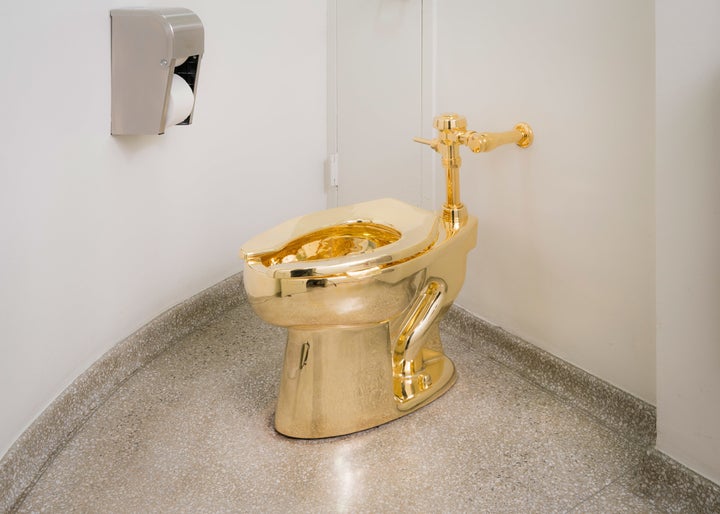 Maurizio Cattelan, “America,” 2016, Gold, 72.4 x 35.6 x 68.6 cm. (Courtesy Marian Goodman Gallery, copyright Maurizio Cattelan.)