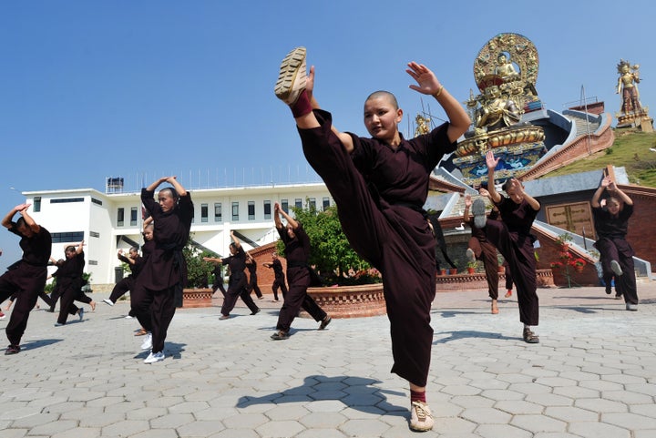 Buddhist nuns practice Kung fu at the Amitabha Drukpa Nunnery on the outskirts of Kathmandu.