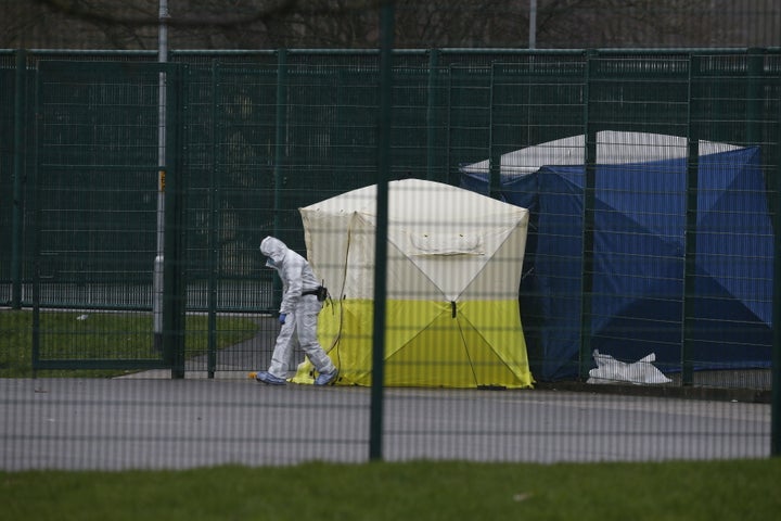 <strong>Forensic officers at the murder scene in February</strong>