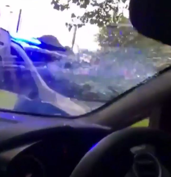 An officer has been caught on video smashing a vehicles windows after the driver refused to get out of the vehicle