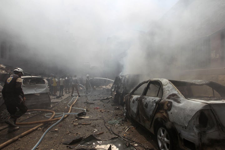 Russian officials and Syrian rebels have cast doubt over the current peace deal. Pictured here, smoke rises over the streets of Idlib, Syria in August.