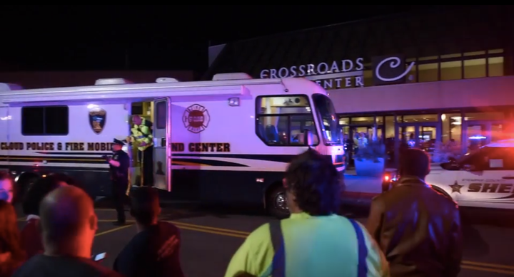 Police said a man wearing a private security uniform wounded eight people in a knife attack Saturday night at the Crossroads