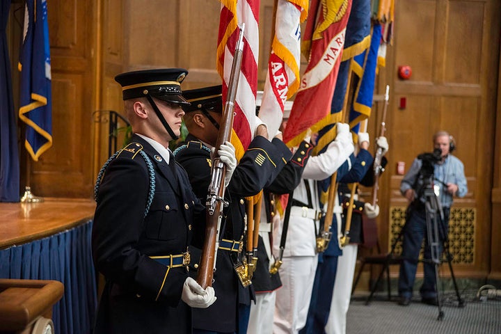 The U.S. Military District of Washington Joint Armed Forces Color Guard presents the colors at an LGBT Pride Observance