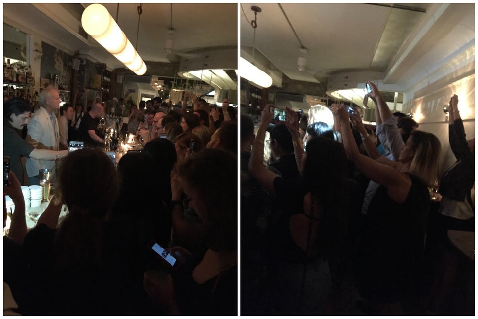 Patrons of 21 Greenpoint snap photos of the bartender.