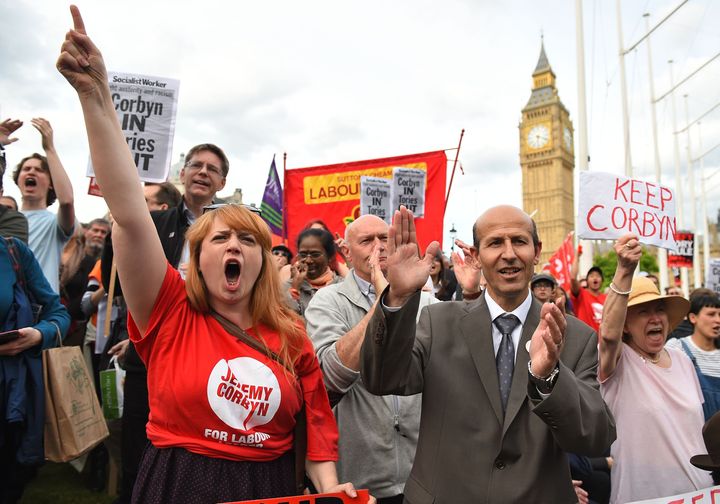 The Momentum campaign group holds a "Keep Corbyn" demonstration outside the Houses of Parliament.