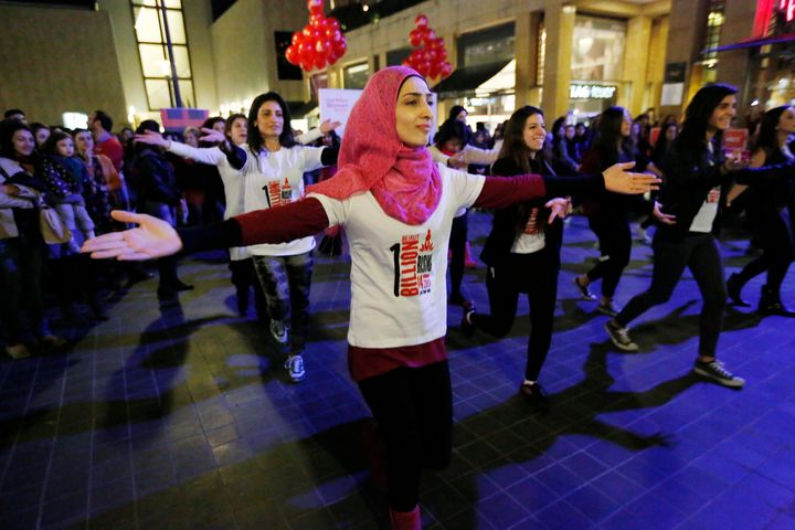 Women dance to the theme song of the "One Billion Rising" campaign in Beirut February 14, 2013.