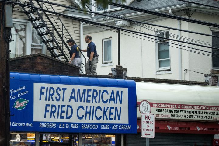 On Monday morning, law enforcement released a photograph of 28-year-old Ahmad Khan Rahami, who they are seeking in connection to the attack. First American Fried Chicken, on the ground floor of their home on Elmora Avenue, is owned by Rahami's father.