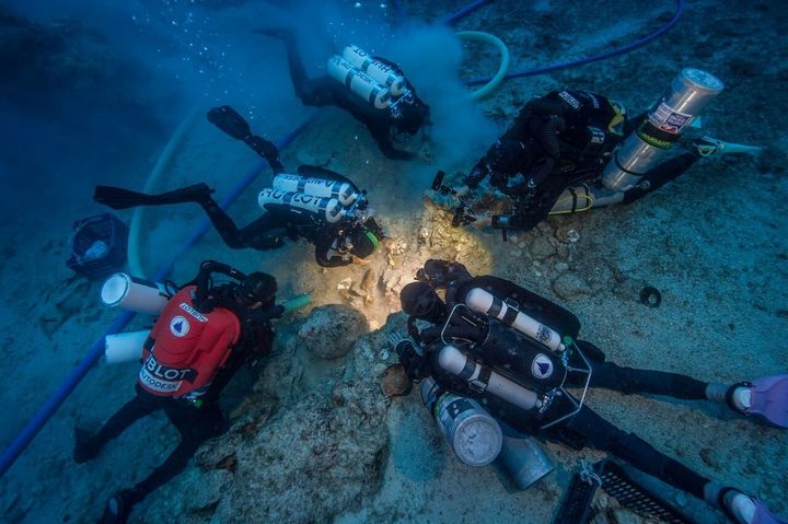 Archaeologists excavate the Antikythera shipwrecks' skeletal remains.