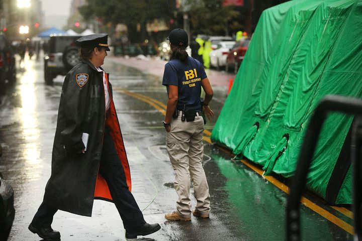 Police and FBI members search around the scene of a bombing in the Chelsea neighborhood of Manhattan on September 19, 2016 in New York City.