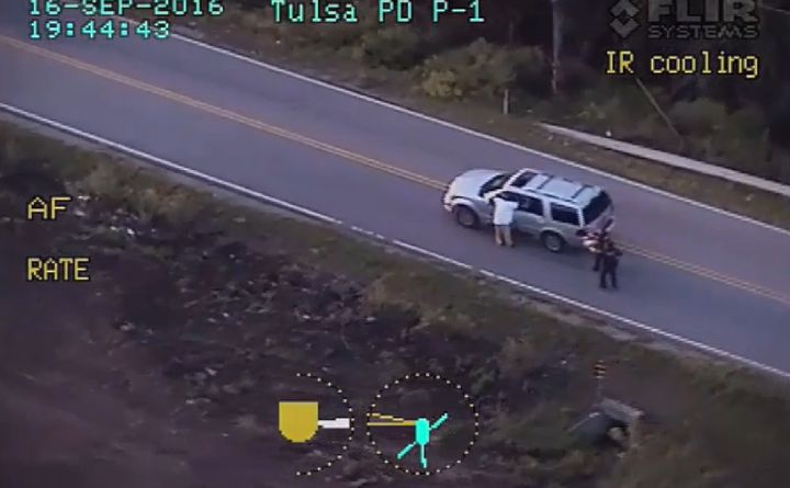 In this photo taken from video footage released Monday by the Tulsa Police Department, Terence Crutcher, left, appears shortly before being fatally shot by an officer.