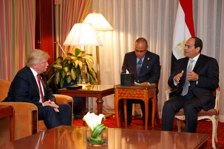 Donald Trump (L) looks on as Egyptian President Abdel Fattah el-Sisi speaks during a meeting at the Plaza Hotel on Monday in New York.