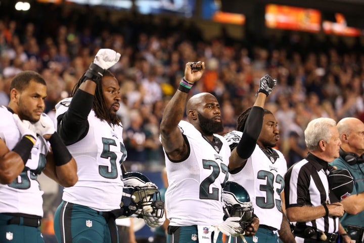 Philadelphia Eagles players Steven Means (51), Malcolm Jenkins (27) and Ron Brooks (33) raise their fists during the national anthem for a game against the Chicago Bears on Monday, Sept. 19, 2016 at Soldier Field in Chicago, Ill.