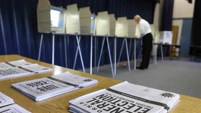 A voter marks his ballot in Elk Grove, California. Most states offer people the opportunity to register to vote when they app
