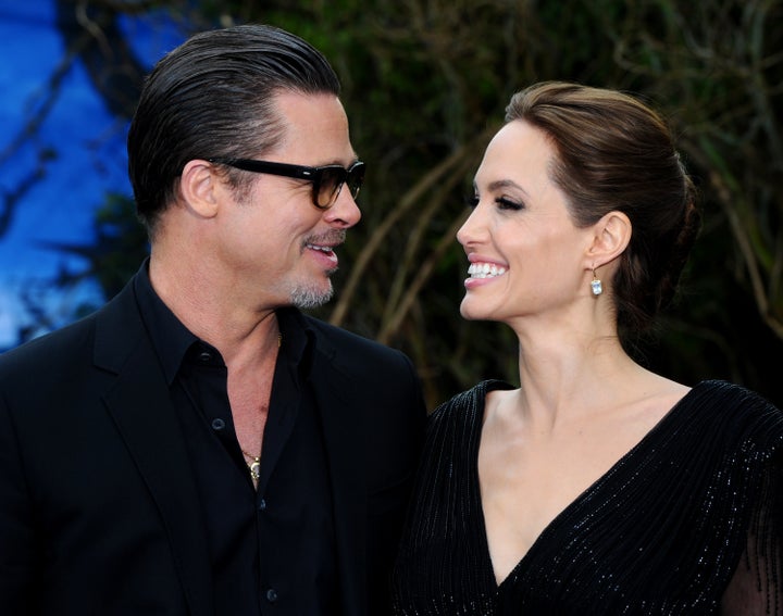 Brad Pitt and Angelina Jolie attend a private reception as costumes and props from Disney's 'Maleficent' are exhibited in support of Great Ormond Street Hospital at Kensington Palace on May 8, 2014 in London, England.