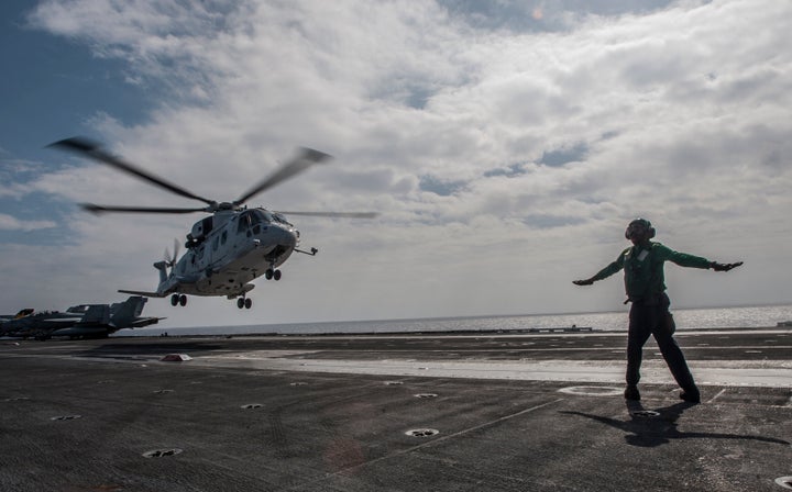 A helicopter of the Japan Maritime Self-Defense Force lifts off from the aircraft carrier U.S.S. George Washington in waters off southern Japan on Nov. 27, 2013.