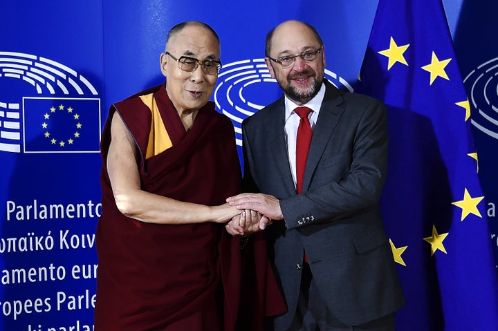 The Dalai Lama (L) is welcomed by European Parliament President Martin Schulz as part of his visit at the European Parliament in Strasbourg, eastern France, on September 15, 2016. /