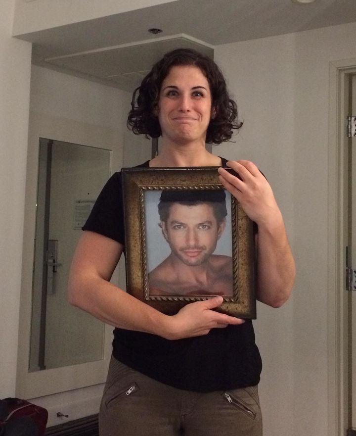 Amy Marsh poses with a steamy photo of Jeff Goldblum in her hotel room.