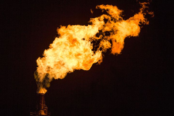 Flames shoot from a tower at the Exxon Mobil Corp. Torrance Refinery in Torrance, California.