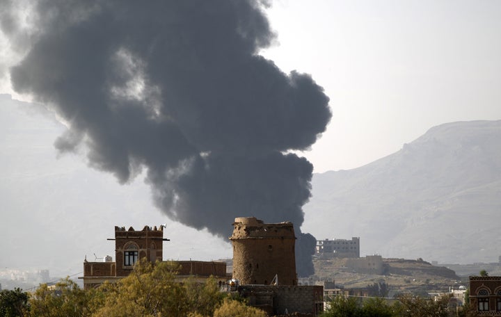 Smoke billows over the Yemeni capital of Sana'a following a reported airstrike carried out by the Saudi-led coalition.