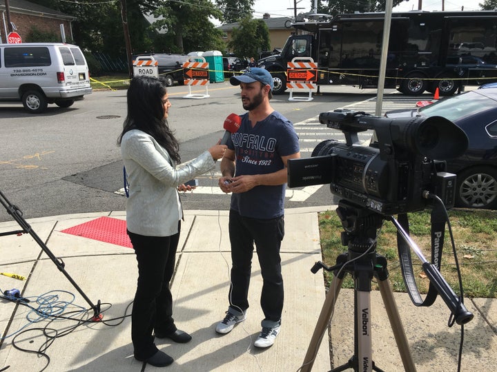 Harinder Singh Bains speaking with a reporter on Sept. 19.