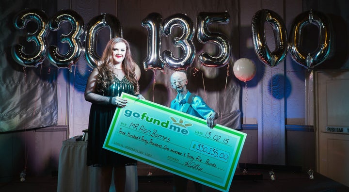 <strong>Cutler presents Barnes with a a cheque for the money raised</strong>